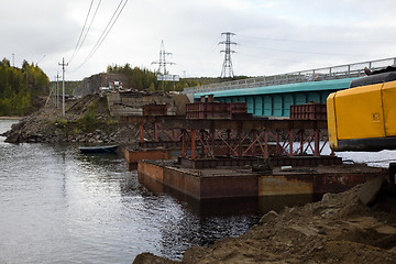 Image showing Construction of the bridge using a craft