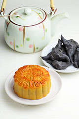 Image showing Moon cake with tea and water caltrop