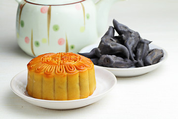 Image showing Moon cake with tea and water caltrop