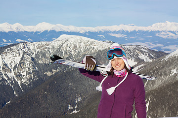 Image showing Pretty girl with skis