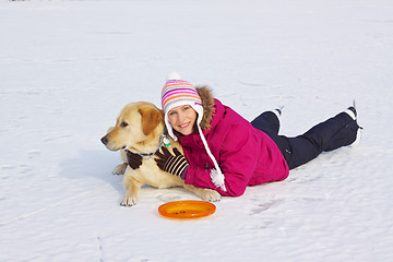 Image showing Girl posing with her dog