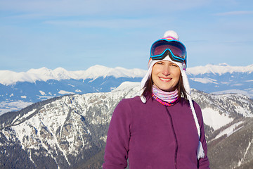 Image showing Smiling girl with winter panorama