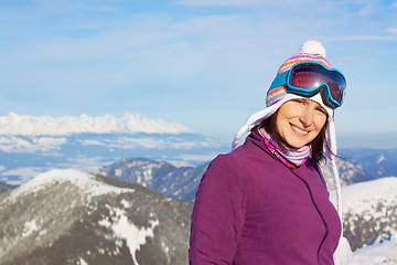 Image showing Smiling girl in winter mountains