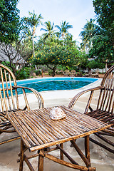 Image showing Chairs on swimming pool border