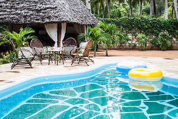 Image showing Chairs on swimming pool border