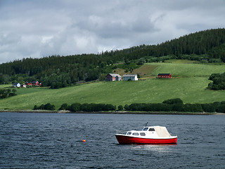Image showing Lonely boat and green coast