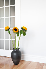 Image showing Sunflowers decorating a room