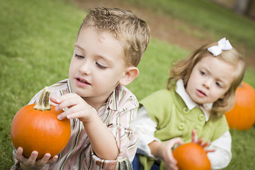 Image showing Cute Young Brother and Sister At the Pumpkin Patch