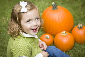 Image showing Cute Young Child Girl Enjoying the Pumpkin Patch.