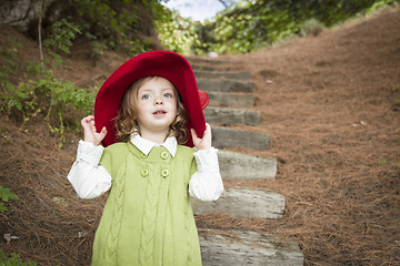 Image showing Adorable Child Girl with Red Hat Playing Outside