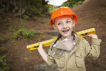 Image showing Adorable Child Boy with Level Playing Handyman Outside