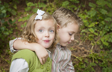 Image showing Adorable Brother and Sister Children Hugging Outside