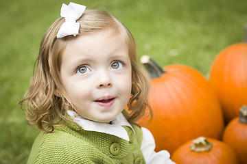 Image showing Cute Young Child Girl Enjoying the Pumpkin Patch.