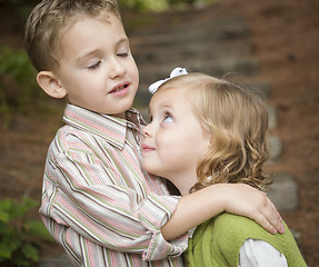 Image showing Adorable Brother and Sister Children Hugging Outside