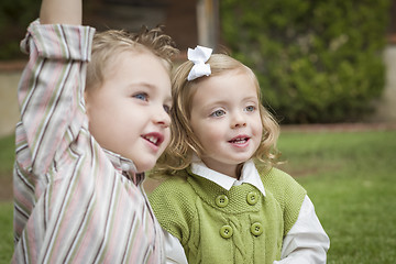 Image showing Adorable Brother and Sister Children Playing Outside