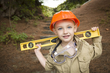 Image showing Adorable Child Boy with Level Playing Handyman Outside