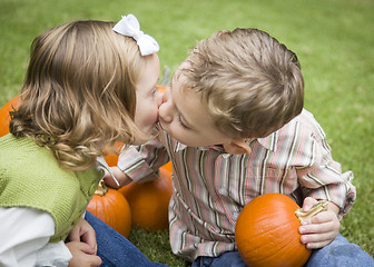 Image showing Cute Young Brother and Sister Kiss At the Pumpkin Patch