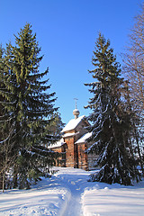 Image showing wooden chapel amongst snow tree