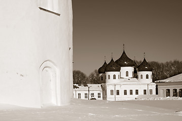 Image showing christian orthodox male priory amongst snow, sepia