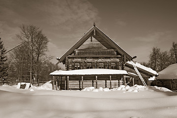 Image showing old wooden house in village , sepia