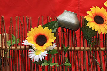 Image showing old pitcher on wooden fence