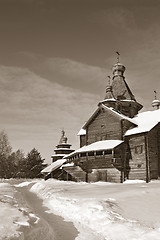 Image showing wooden chapel in winter village, sepia