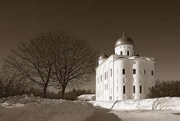 Image showing christian orthodox male priory amongst snow, sepia