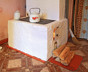 Image showing brick stove in rural wooden house 