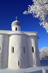 Image showing tree in snow against christian church 