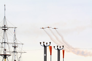 Image showing three small planes in cloudy sky