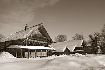 Image showing old wooden house in village , sepia