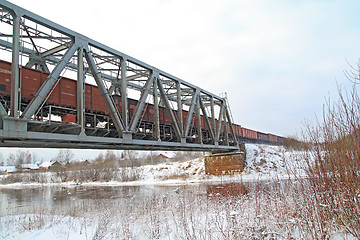 Image showing freight train on railway bridge 