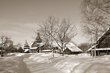 Image showing wooden chapel in winter village, sepia