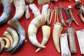 Image showing caucasian souvenirs on red table