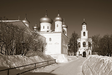 Image showing christian orthodox male priory amongst snow, sepia