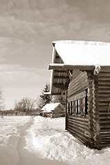 Image showing old wooden house in village , sepia