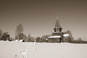 Image showing wooden chapel on snow field, sepia