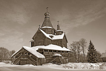 Image showing wooden chapel in winter village, sepia