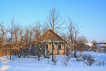 Image showing old rural house amongst snow