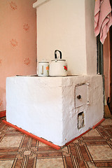 Image showing brick stove in rural wooden house 