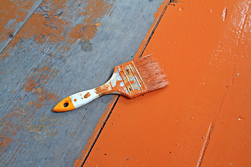 Image showing dirty brush in red paint