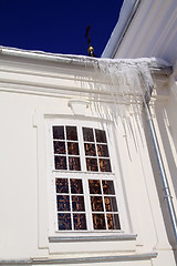 Image showing icicles on roof of the white building