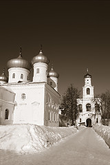 Image showing christian orthodox male priory amongst snow, sepia