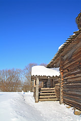 Image showing rural wooden house amongst snow