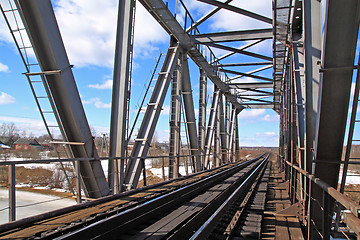 Image showing railway bridge through freeze river 