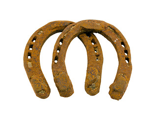 Image showing Retro rusty pair of horseshoes isolated on white 