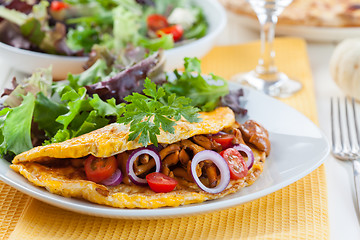 Image showing Omelet filled with chanterelle mushrooms