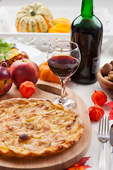 Image showing Apple pie or tart with red wine
