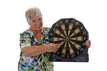 Image showing Female senior with darts 