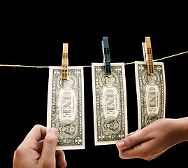 Image showing Dollars on the wire